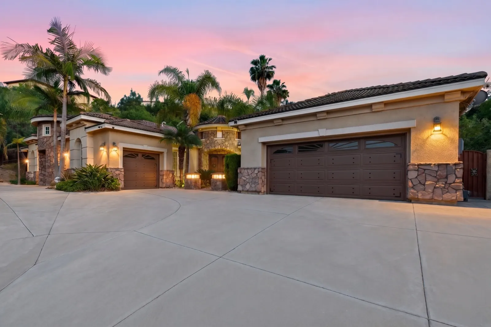 Front exterior with palms at twilight